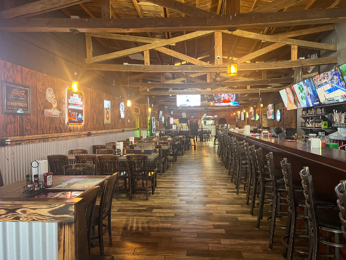 Rustic dining area with wooden tables and American flag decor